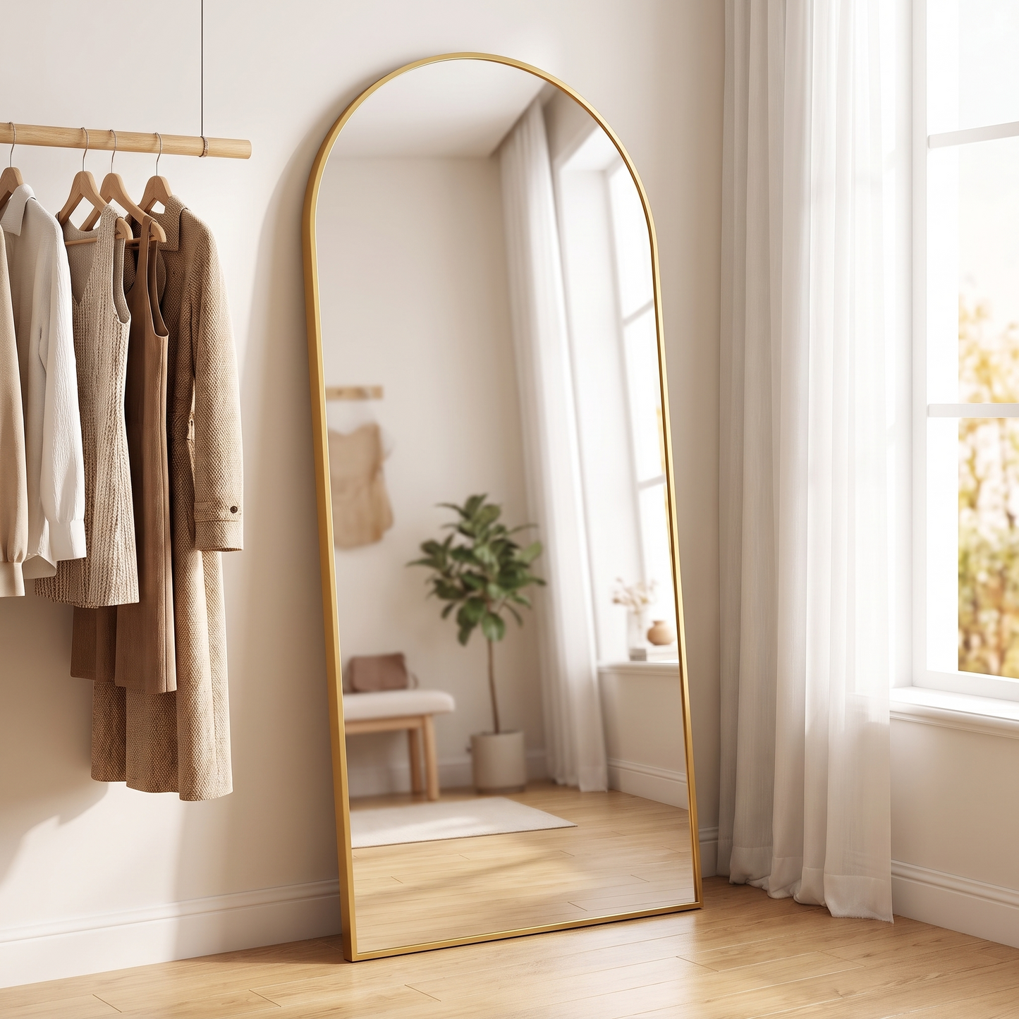 Gold metal arched full-length mirror in a dressing room