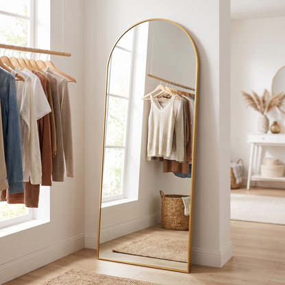 Gold metal arched full-length mirror, dressing room detail