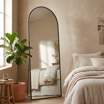 Silver arched stand full-length mirror in a modern bedroom
