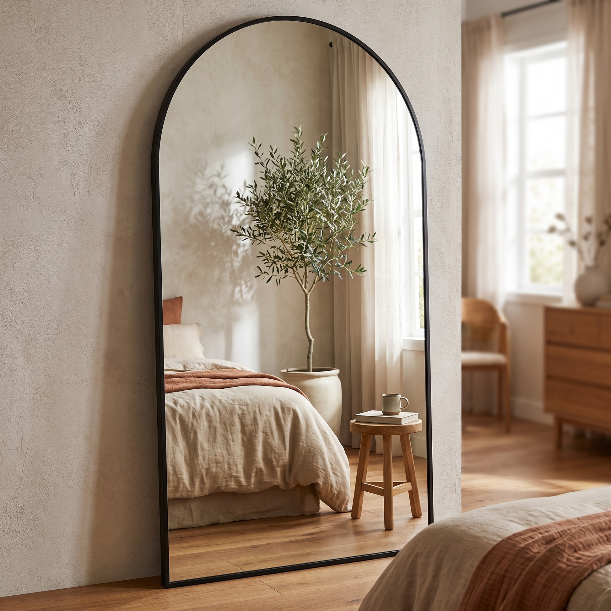 Easly oversized black arched full-body mirror in a modern bedroom