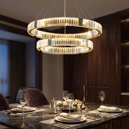 Style 5 chandelier lit above a dining table in the evening