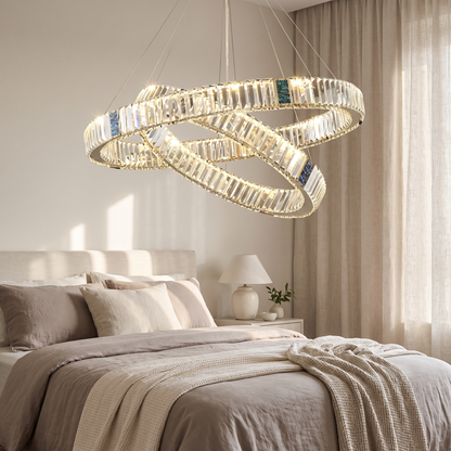 Style 7 chandelier lit in a calm modern bedroom