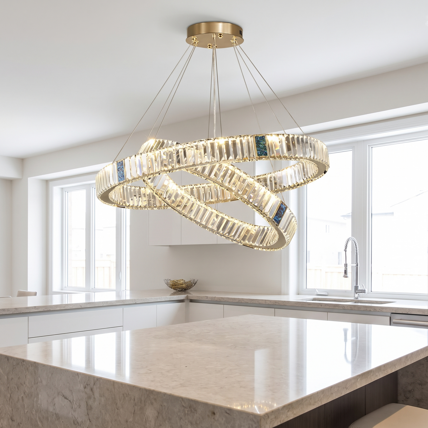 Style 8 chandelier lit above a kitchen island