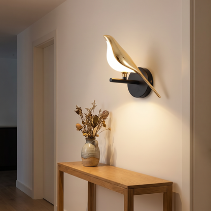 Metal bird shape LED wall sconce above a hallway console