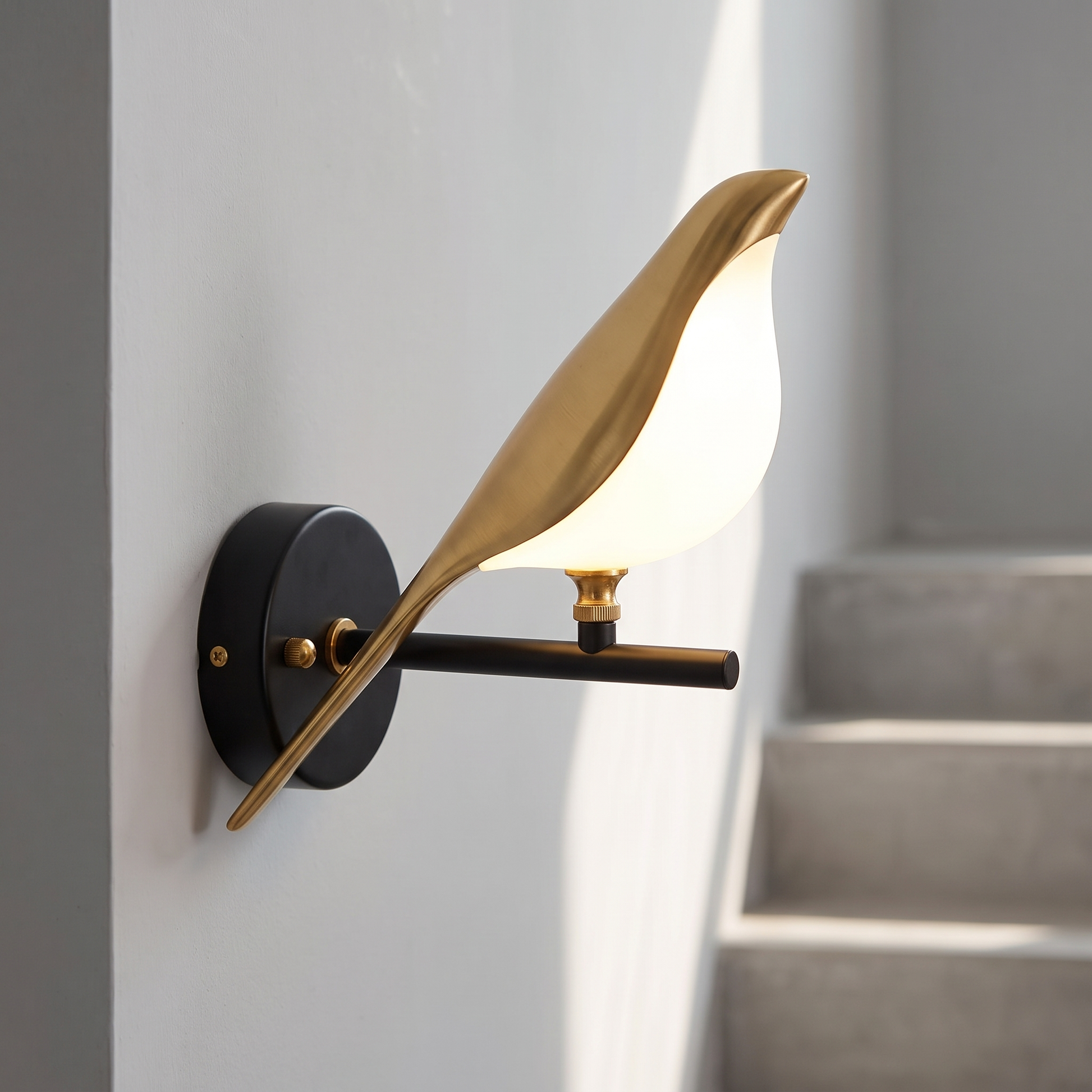 Close detail of the metal bird shape LED wall sconce