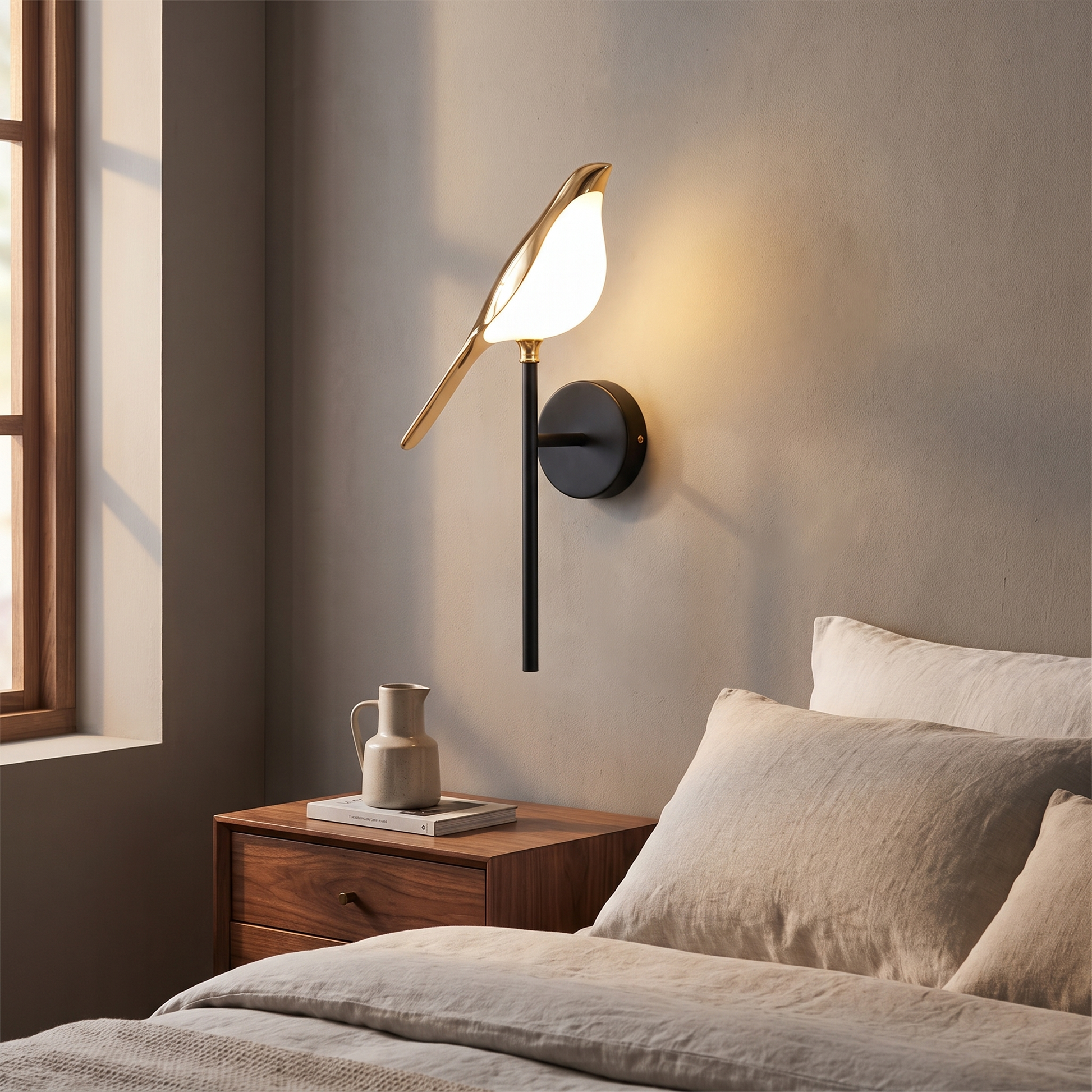 Metal bird shape LED wall sconce above a bedside table