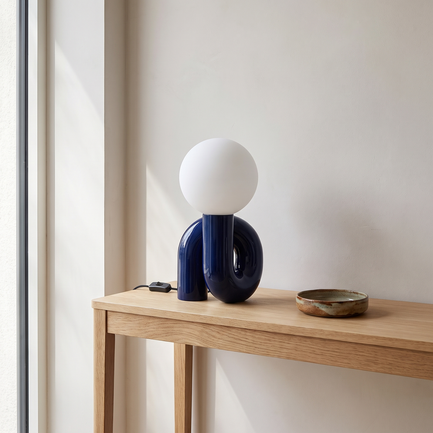 Resin table lamp on an entryway console