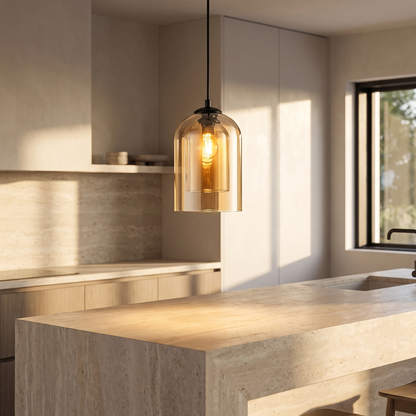 Amber glass pendant light above a kitchen island