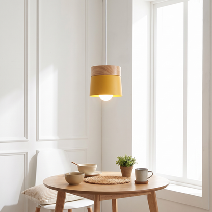 Yellow solid wood pendant light above a breakfast nook