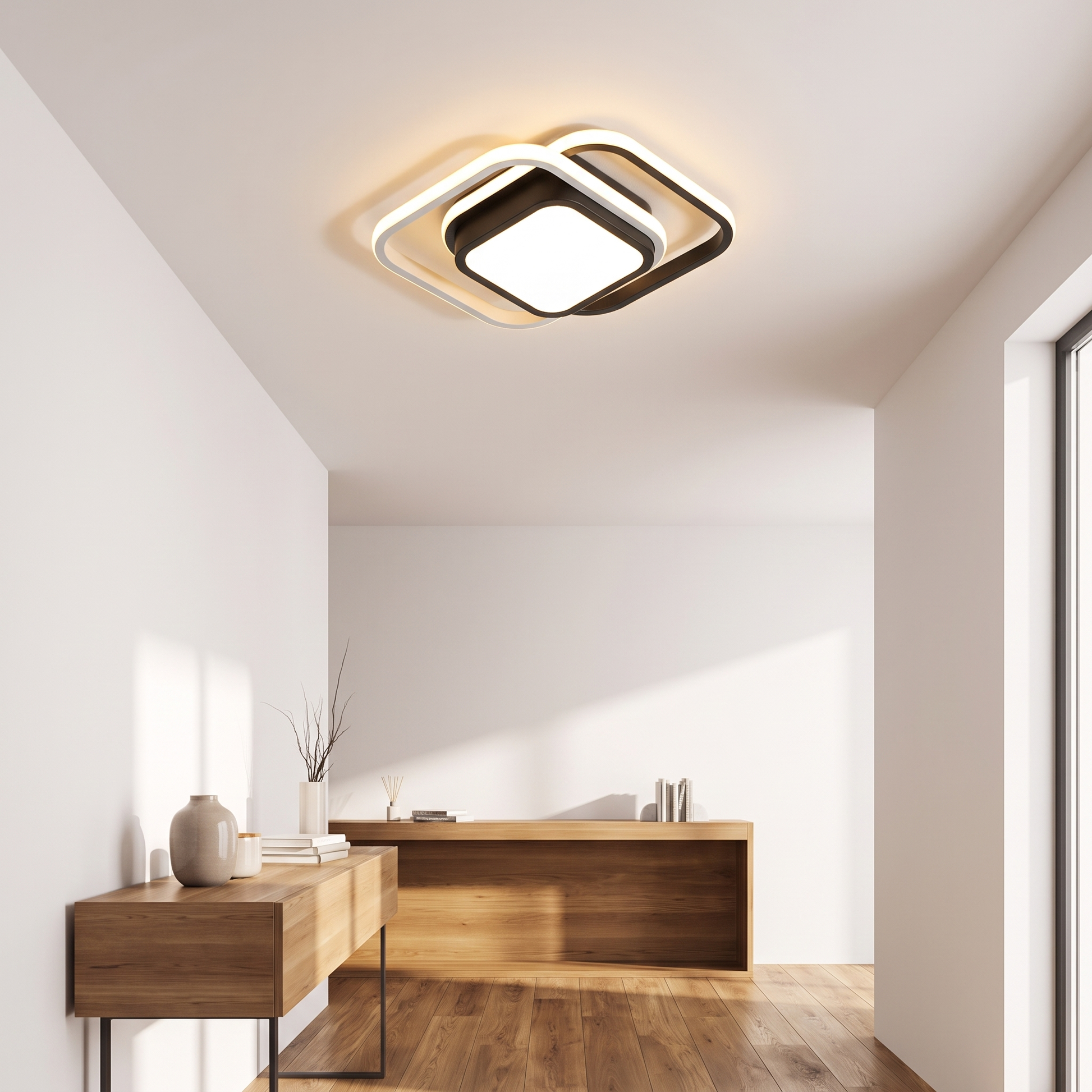 Square white and black minimalist ceiling light in a hallway