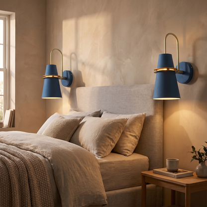 Pair of Nordic wall sconces either side of a bed