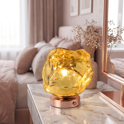Rose gold lava stone glass table lamp on a marble vanity
