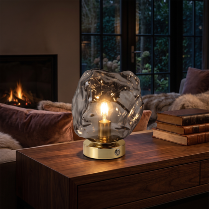 Smoky grey lava stone glass table lamp on a dark console