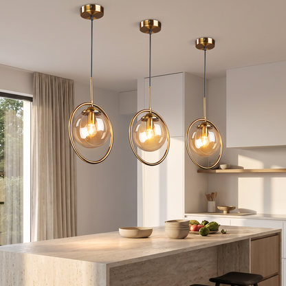 Amber glass pendant light above a kitchen island