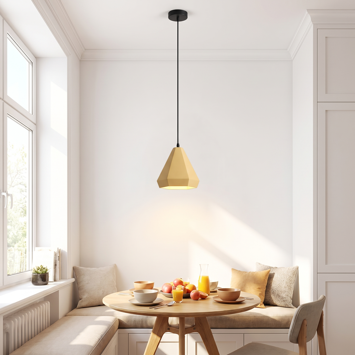 Light yellow geometric LED pendant light above a breakfast nook