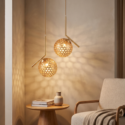 Copper gold spherical honeycomb pendant light in a living room