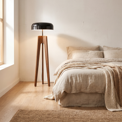 Solid wood floor lamp in a minimalist bedroom corner