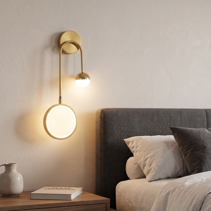 Left-facing Modern Malibu wall sconce beside a bed