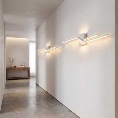 Pair of linear LED wall sconces along a hallway