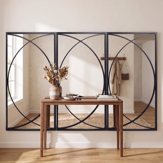 LuxAura Arc Trio Black Metal Wall Mirror Set in an entryway