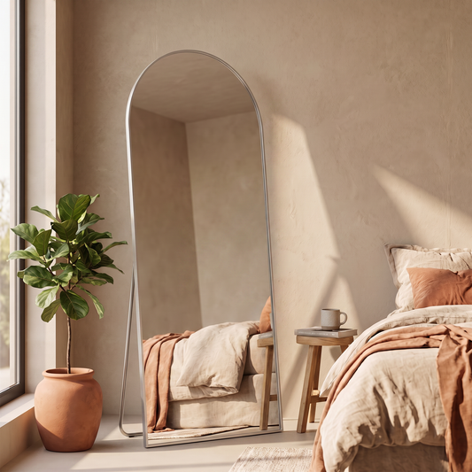 LuxAura Arch Floor Mirror in a bedroom