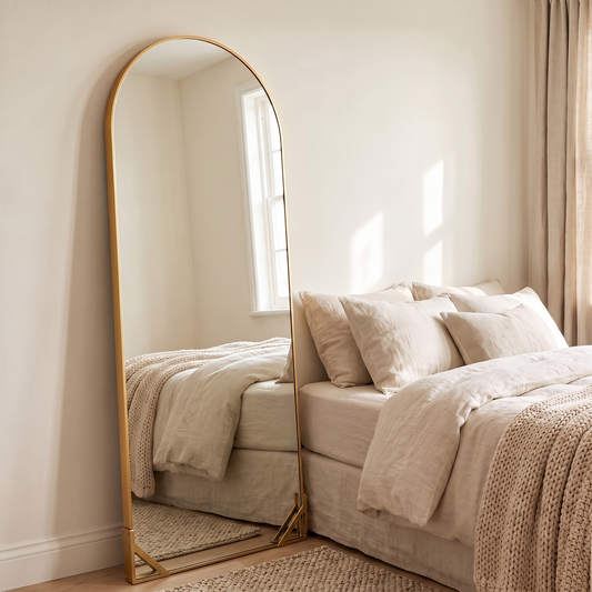 LuxAura Gold Arch Bracket Mirror in a bedroom