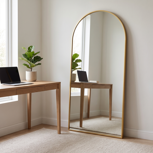 Gold full length floor mirror in a home office corner