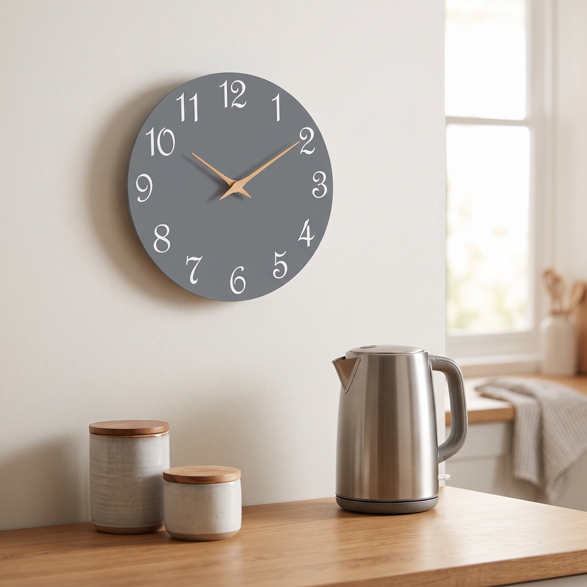 Gray 8 inch modern wall clock mounted in a kitchen