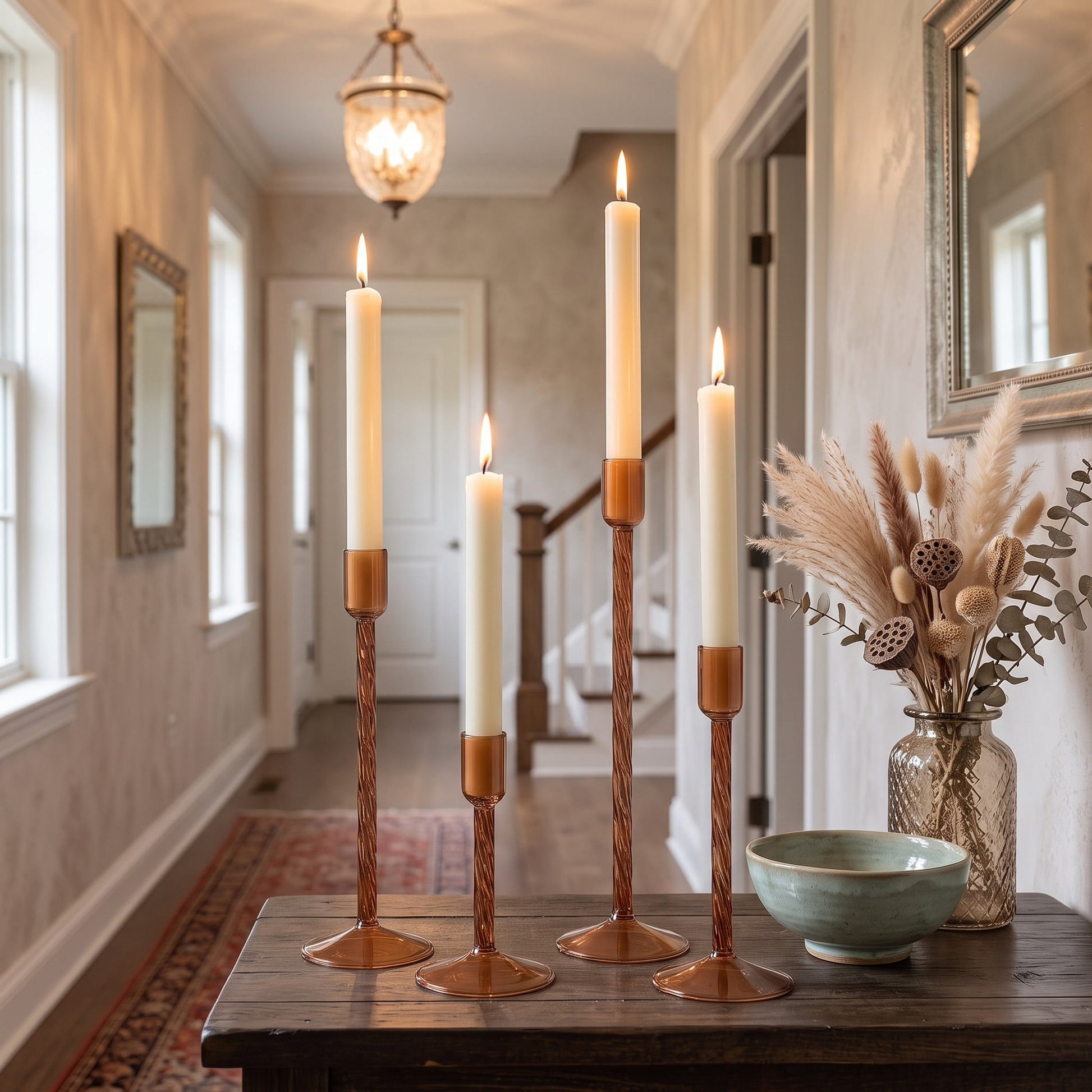 Brown glass taper candle holders on an entryway console table