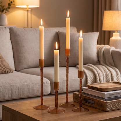 Brown glass taper candle holders on a living room coffee table
