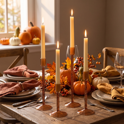 Brown glass taper candle holders on a Thanksgiving dining table