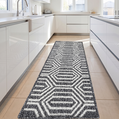Black runner rug in front of kitchen cabinetry