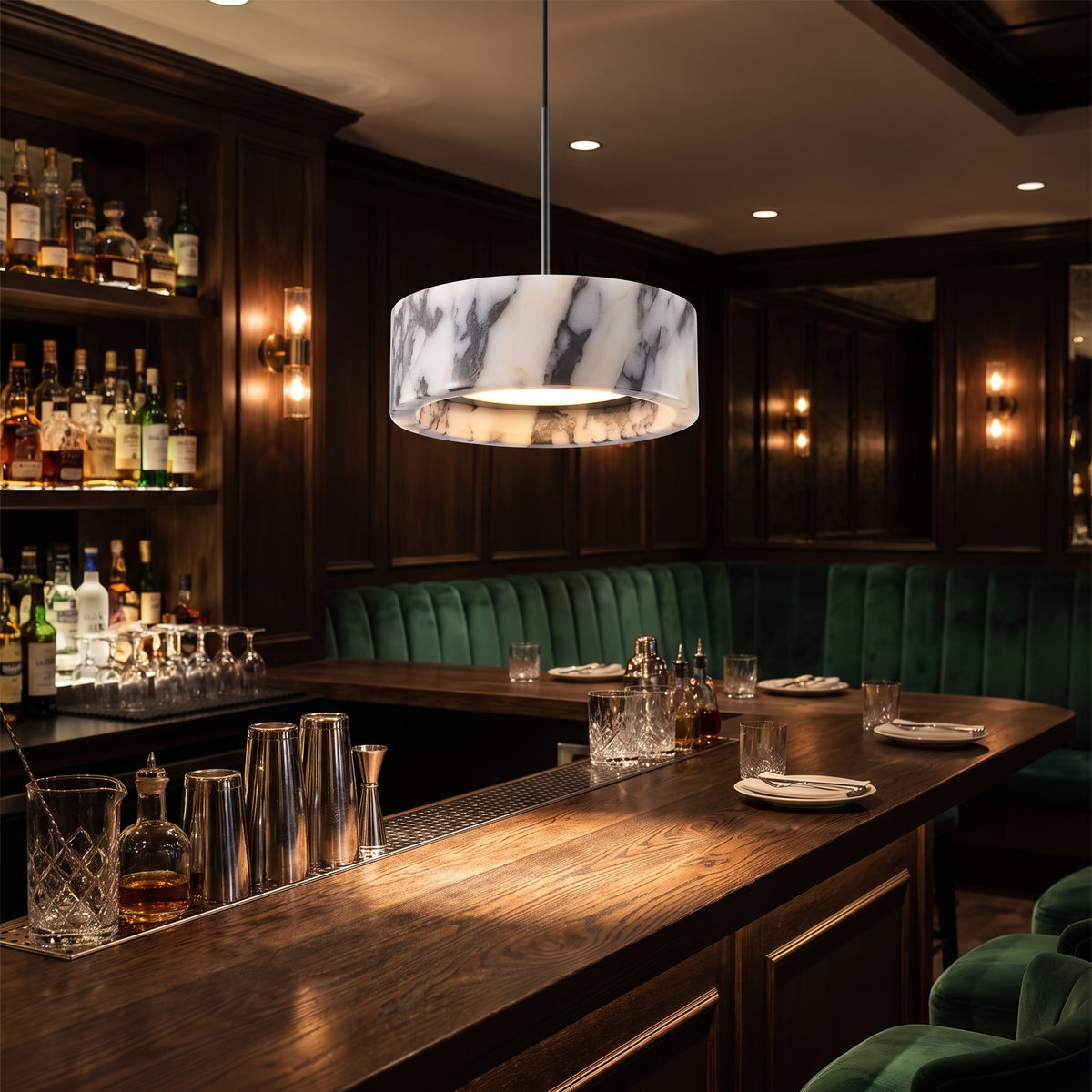 Marble drum pendant light over a bistro bar counter at night