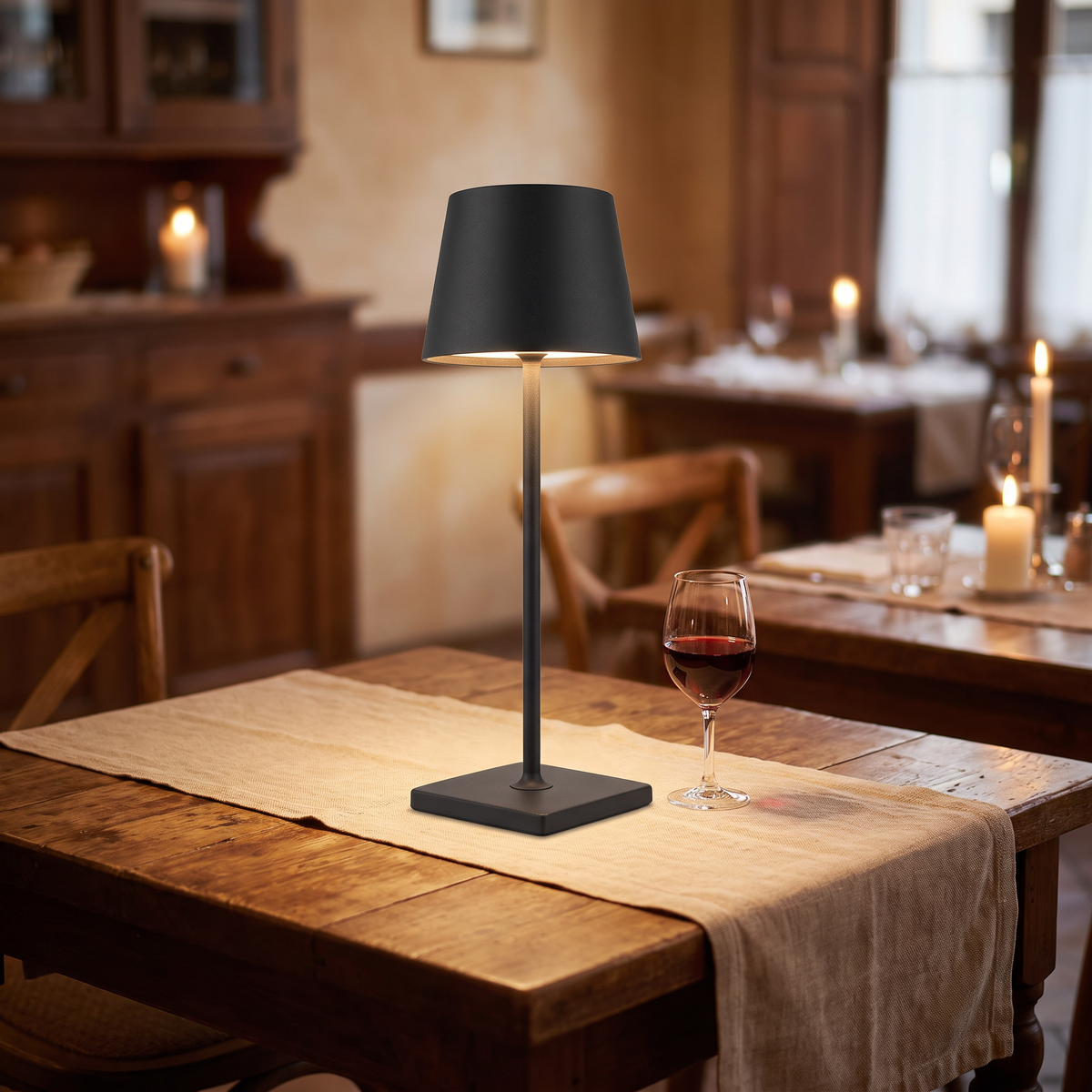 Black cordless table lamp on a restaurant table