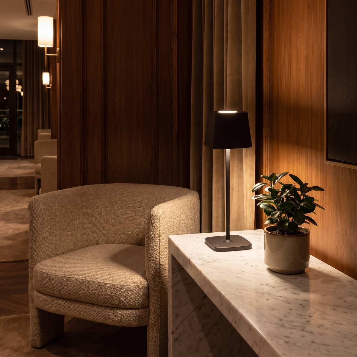 Cordless table lamp on a hotel lobby console