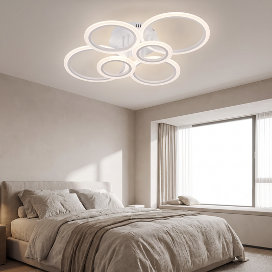 Six-ring LED ceiling light in a modern bedroom