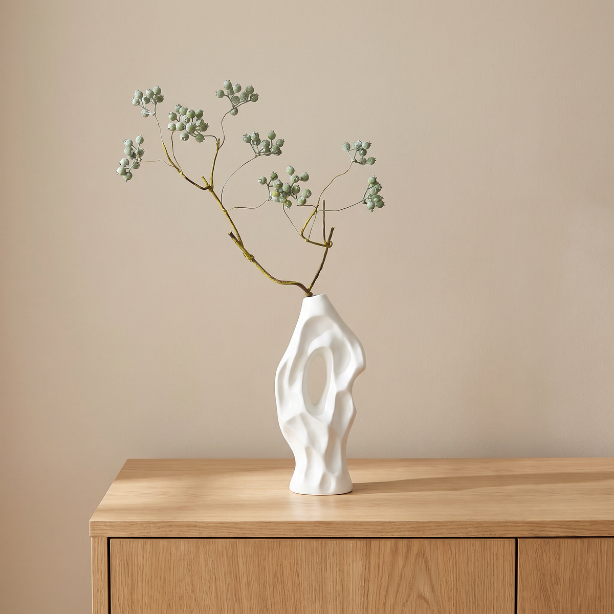 White vase with artificial mistletoe
