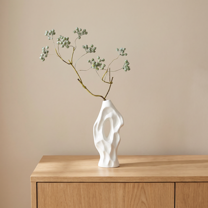 White vase with artificial mistletoe