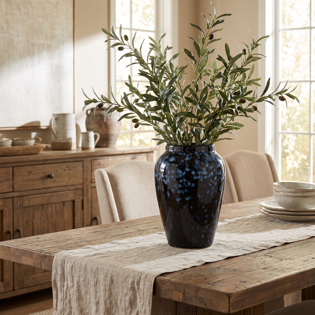 Handmade glazed ceramic vase on a dining table