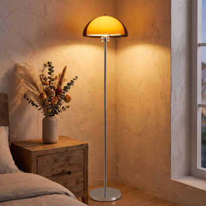 Bauhaus LED floor lamp with amber shade in a bedroom corner