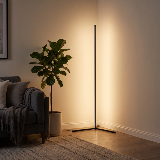 Minimalist LED corner floor lamp glowing warm white in a living room