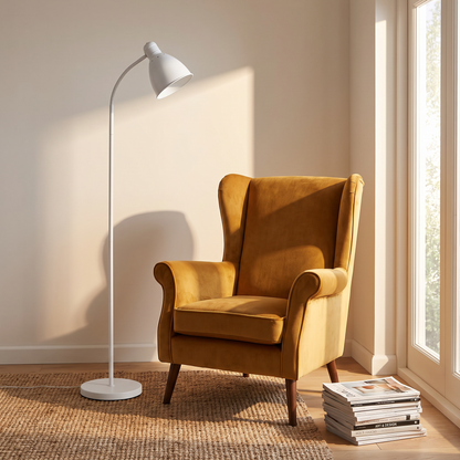 Scandinavian floor lamp Style B in white beside an armchair