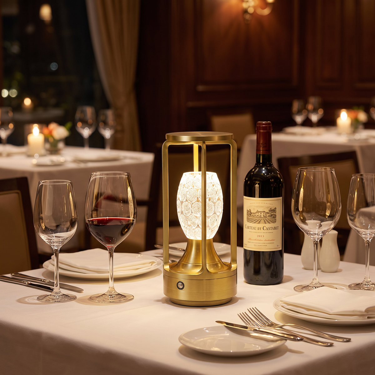 Gold cordless crystal table lamp on a dinner table
