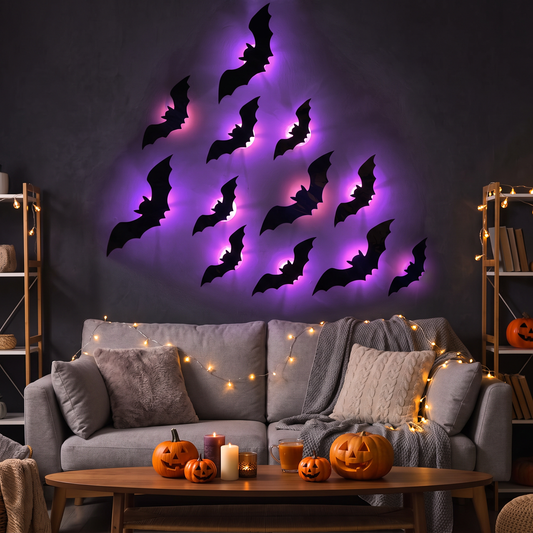 3D bat wall stickers with purple LED glow above a sofa