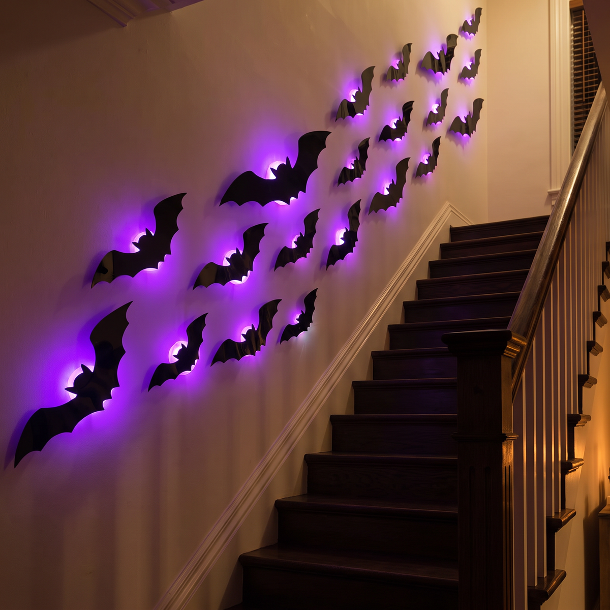 Glowing bat wall stickers along a staircase