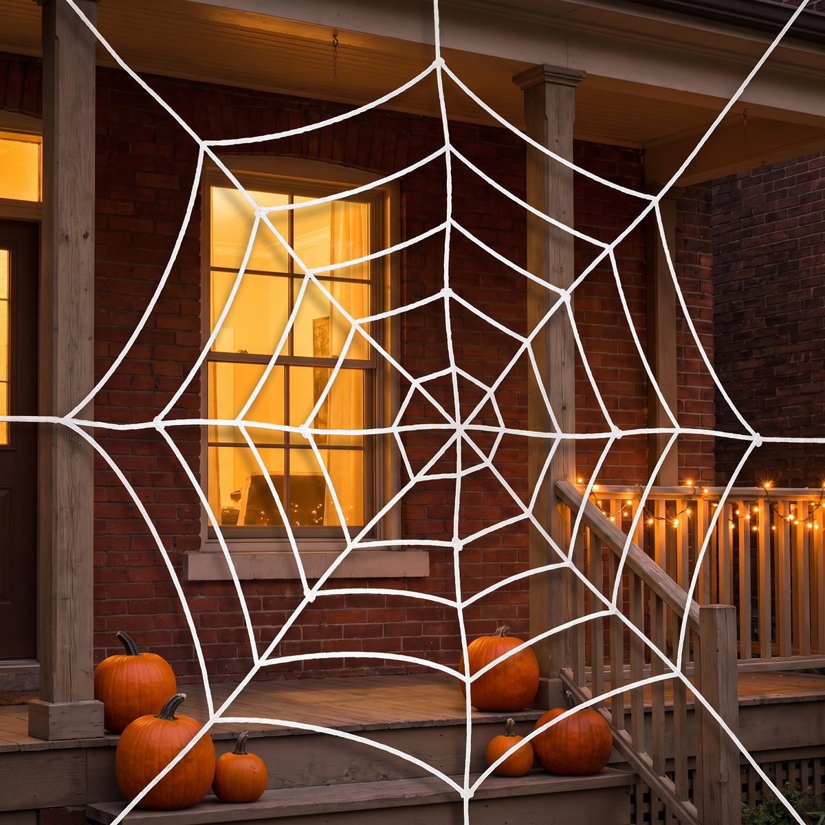 White round spider web decoration on a front porch