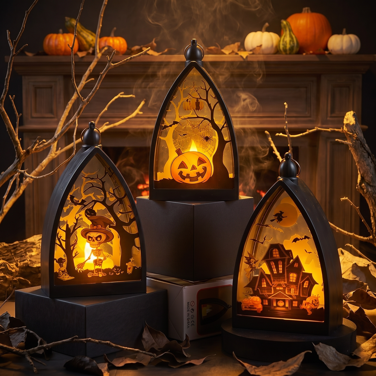 Three Halloween atmosphere lanterns on a mantel