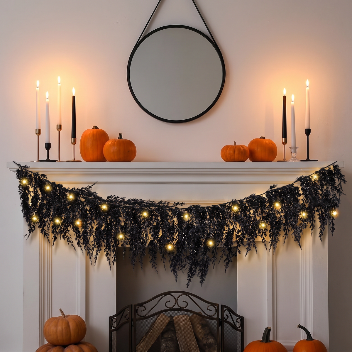 Black pine garland with lights on a fireplace mantel