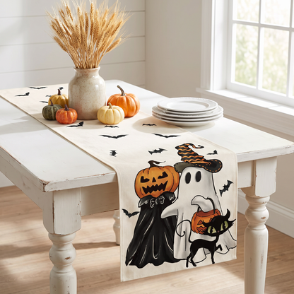 Pumpkin and ghost Halloween table runner on a farmhouse kitchen table