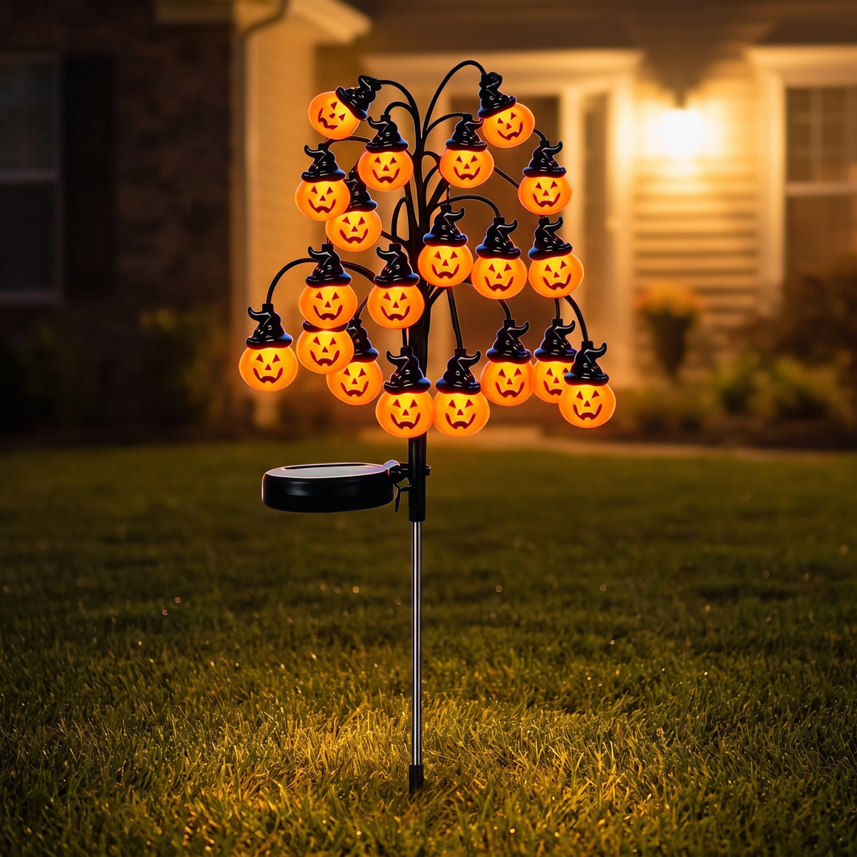 Top-Hat Pumpkin Branch Lamp Warm 20L on a front lawn at night